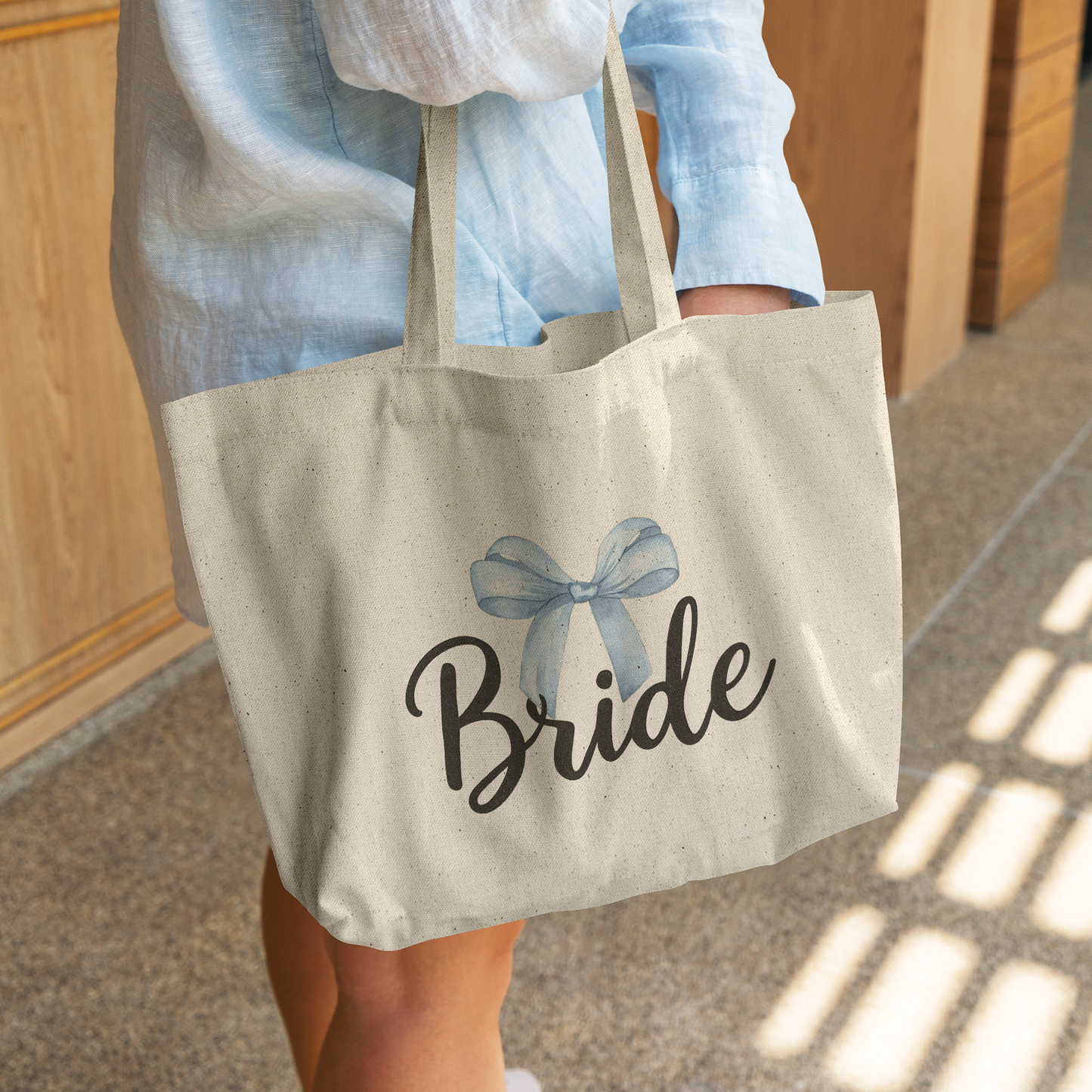Bride_Tote_Bag__Something_Blue_CottonTote_L_WomanDigging_Mockup.png_14763974