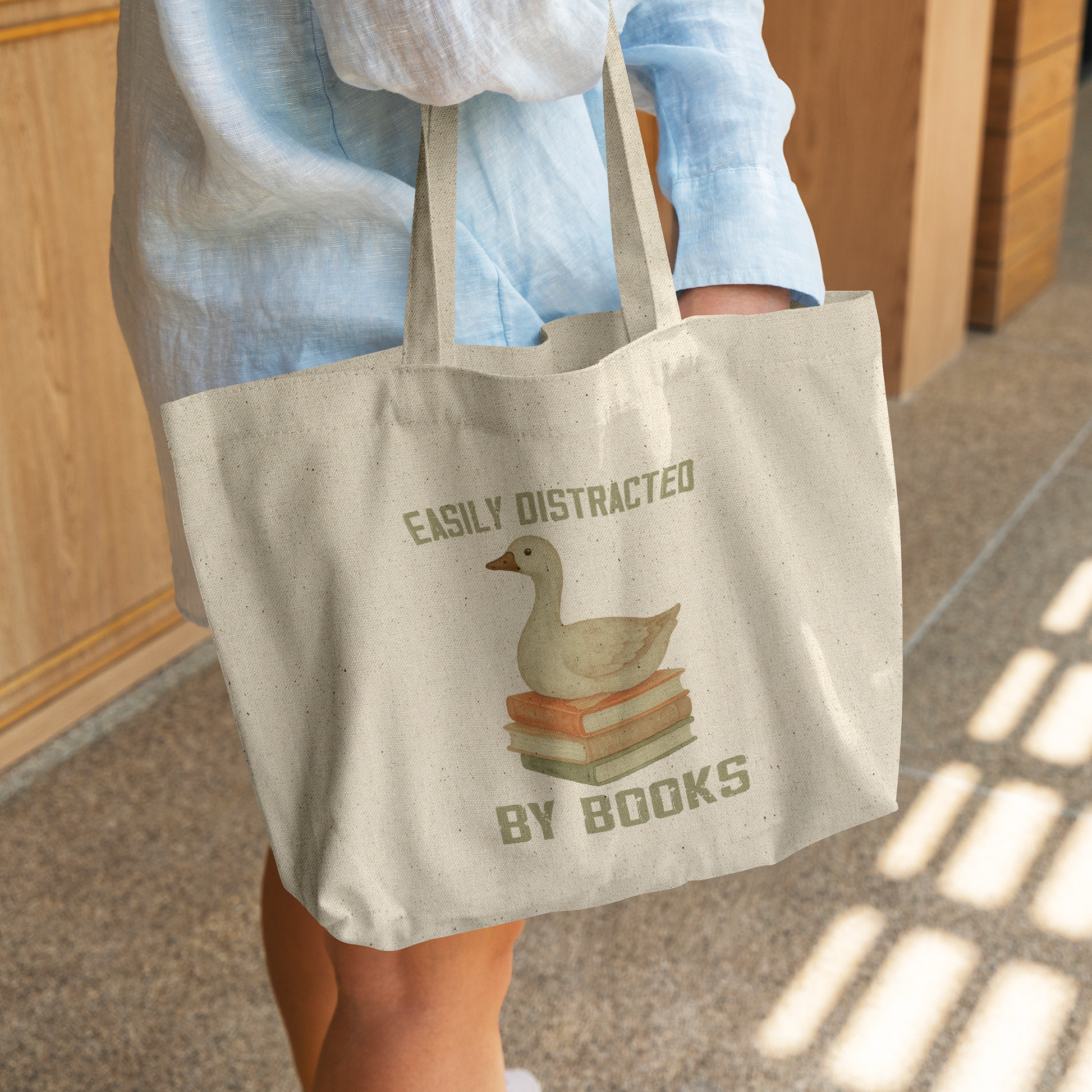 Easily_Distract_By_Books_Canvas_Tote_Bag_CottonTote_L_WomanDigging_Mockup.png_14722469